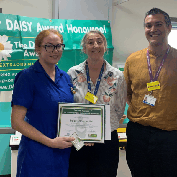 Photo of Paige Solomons (left) receiving her award from Sharon McNally (centre) and Giuseppe Labriola (right).