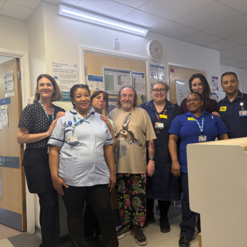 John Ley (centre) with staff from Fleming Ward