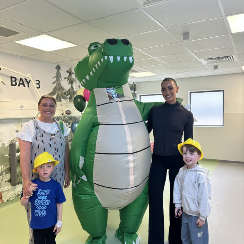 Ella-Mae Rayner with Alex the Alligator, young patients and their families.