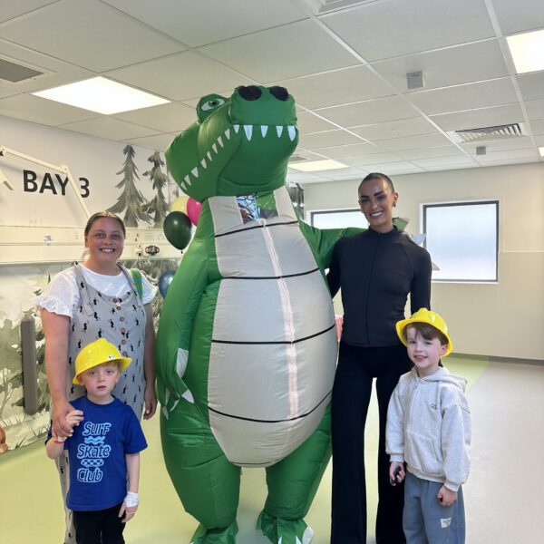 Ella-Mae Rayner with Alex the Alligator, young patients and their families.